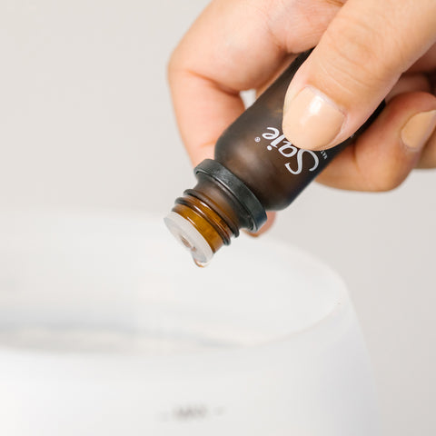 Diffuser blend being added to a Saje diffuser