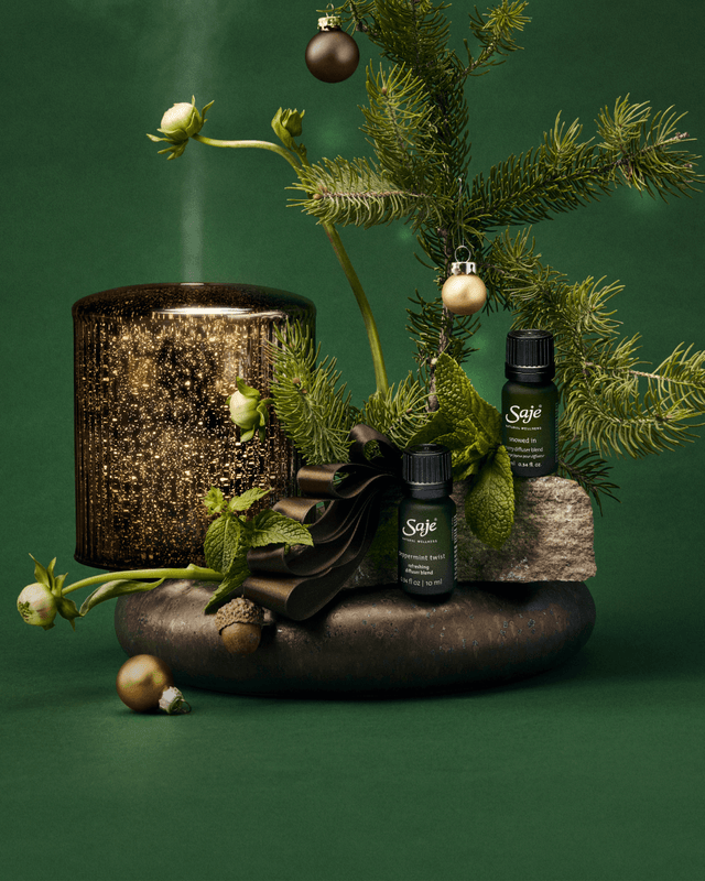 Aroma Lustre Diffuser, Snowed In and Peppermint Twist Diffuser Blend products among festive decor.