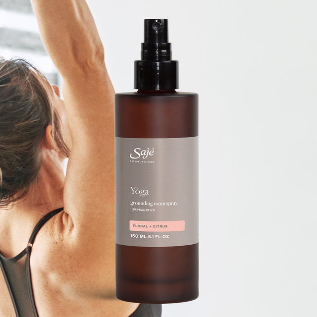 Yoga Room Spray on background wit person doing yoga